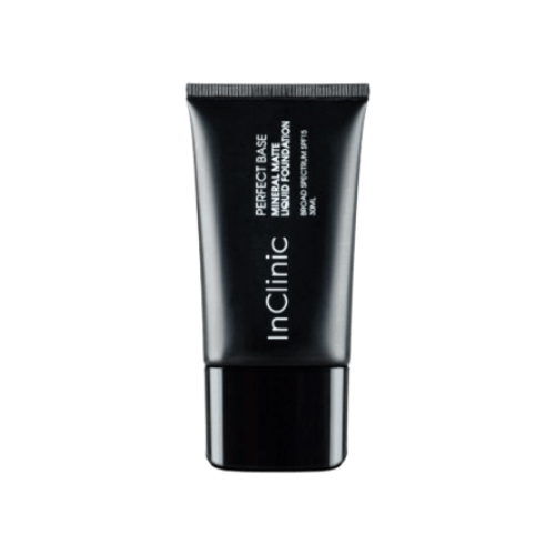 A close-up product image of a black squeeze tube of InClinic Perfect Base Mineral Matte Liquid Foundation Broad Spectrum SPF 15.